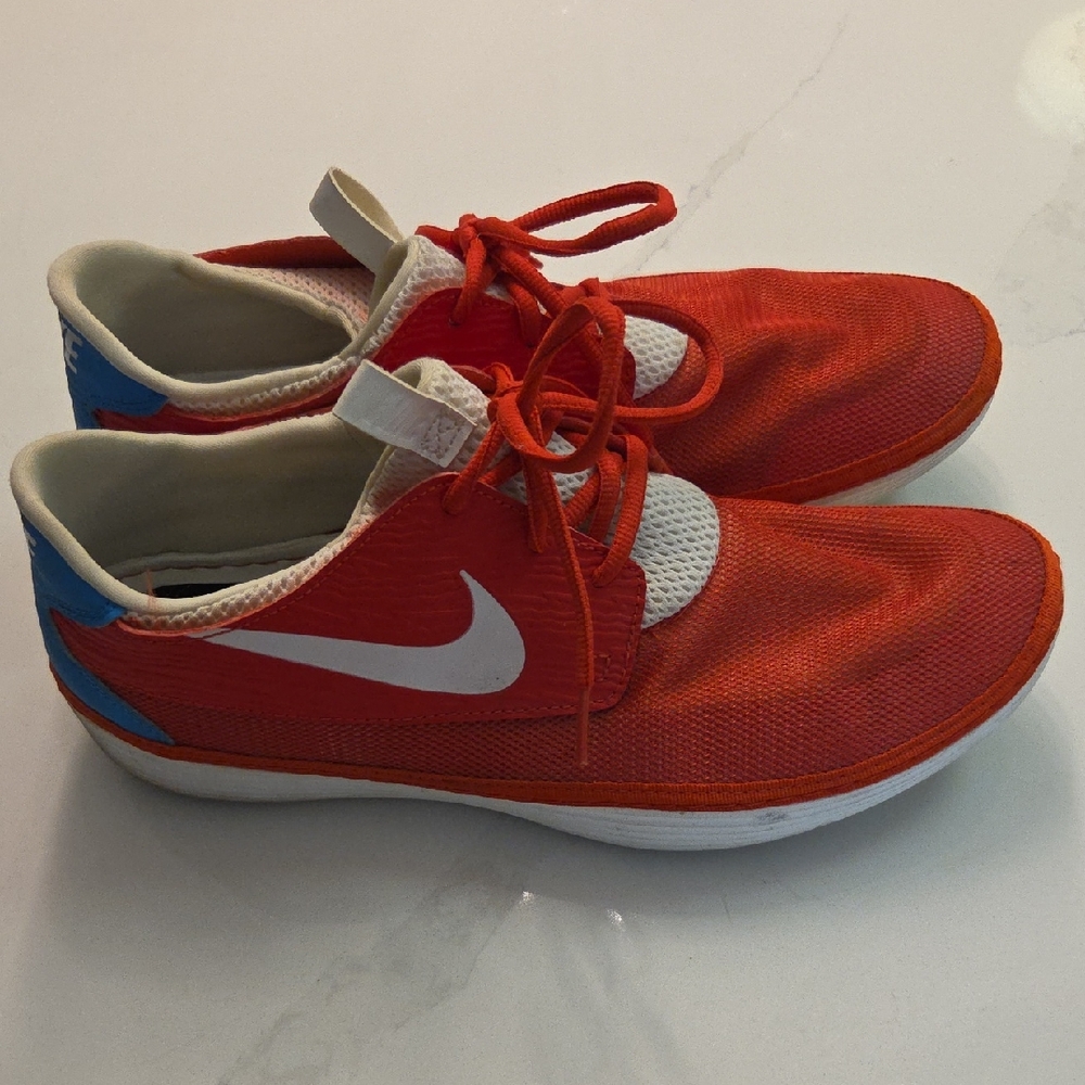 Nike Red Athletic Sneakers with White Swoosh and Blue Heel